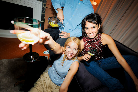 Friends enjoying drinks and social gathering joyfully