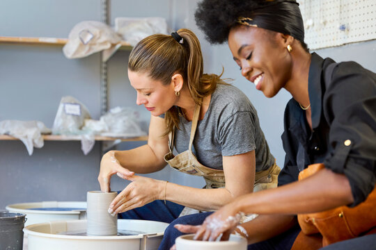 Two Women Making Pottery in a Craft Studio
