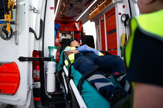 Patient receiving medical attention inside ambulance