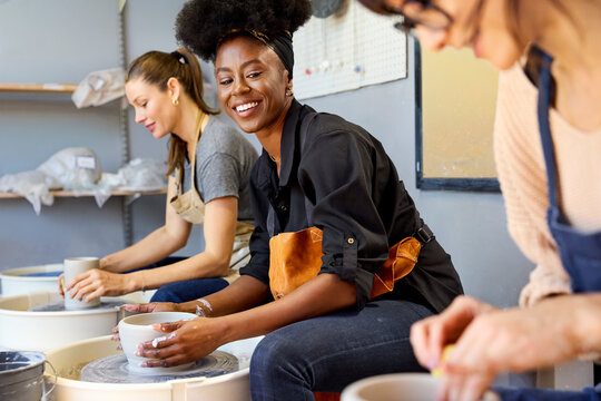 Women Working on Pottery in a Craft Studio