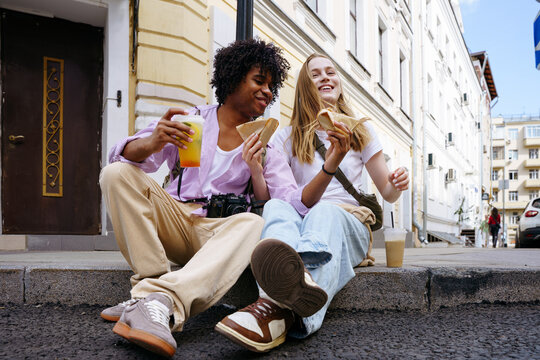 Tourists enjoying street food in city