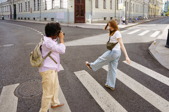 Tourists walk around the city and take photos