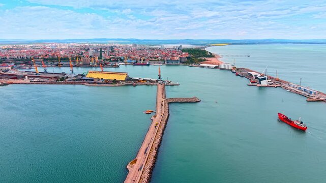 Coastline with a busy harbor. Coastline with a busy harbor. There are boats in the water and buildings in the city. The sky is clear.