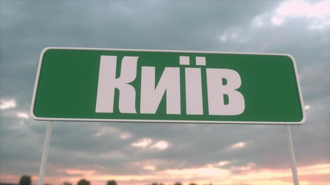 Green Kyiv Road Sign Against Dramatic Cloudy Sunset Sky