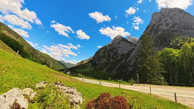 4K Timelapse alpine video with moving clouds at Kaiserbachtal valley, Griesenau, Wilder Kaiser, Kitzbuehel, Tyrol, Austria