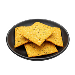 Fototapeta premium Crispy golden yellow snacks stacked on a dark plate isolated on white background