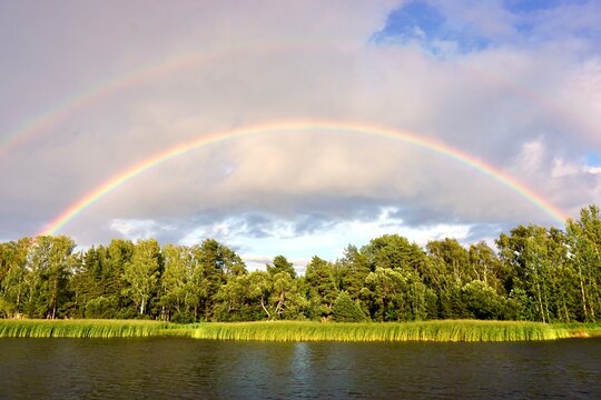 scenic rural landscape with double rainbow in Estonia