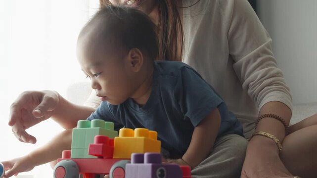 A serene moment of play features a child engrossed in colorful building blocks, highlighting the importance of developmental activities. The nurturing atmosphere fosters creativity and learning.