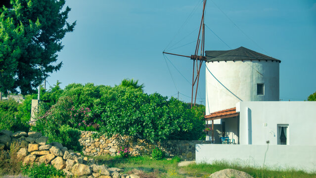 Traditional windmill on the island of Kos, Greece, with scenic l