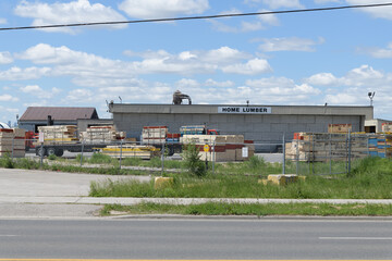 Naklejka premium wide view of lumber yard at Home Lumber Inc, a lumber store, located at 714 Birchmount Rd, Scarborough, Toronto