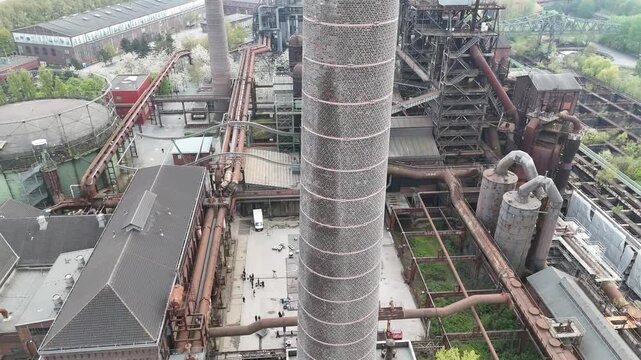Fast Descent Past Smokestack Into Production Courtyard