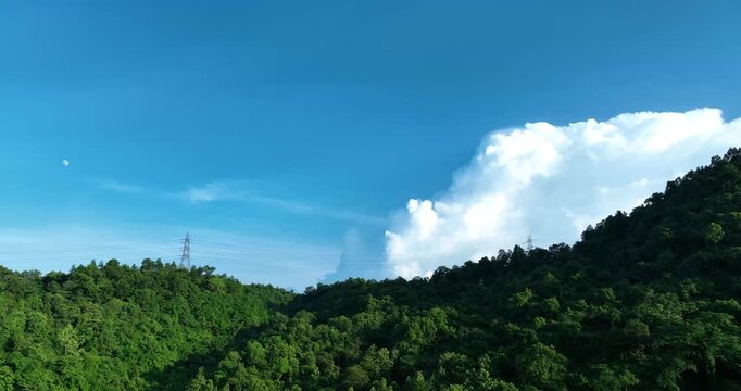 A drone tilt-up shot unveils Assam&rsquo;s hills merging with the tranquil sky, creating a breath-taking scene filled with peace, natural splendour, and poetic harmony of earth and heaven. 4K