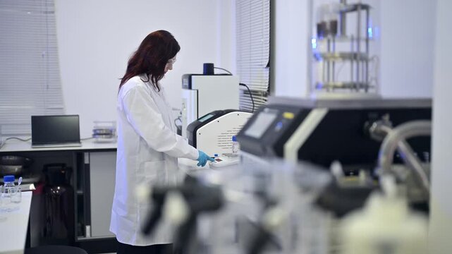 Working in a lab with equipment and conducting tests in a modern facility