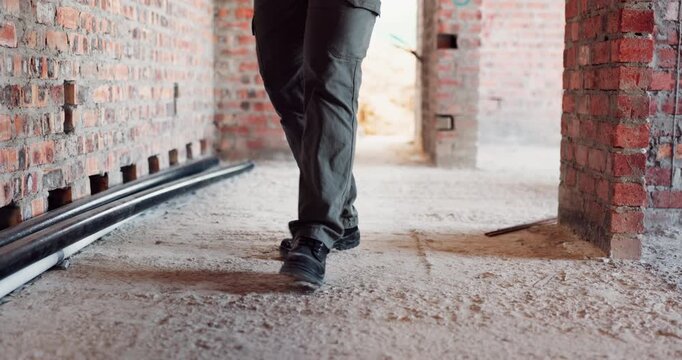 Construction, dance or legs on site with rhythm, energy or playful groove with project milestone. Achievement, man or engineer in building with fun time, feel good or upbeat movement in celebration.