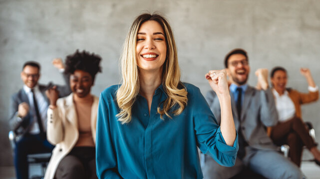 Joyful, excited diverse entrepreneurs are celebrating their success and the great work environment