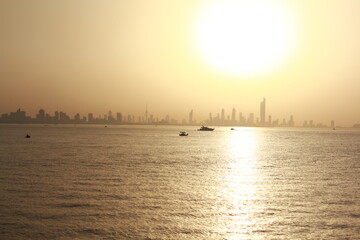 Fototapeta premium Kuwait Skyline featuring Kuwait Towers, Kuwait flag, Kuwait City skyline, Kuwait sunset, Kuwait beach, Kuwait evenings, Kuwait summer, Kuwait heat, and Kuwait National Day pride.