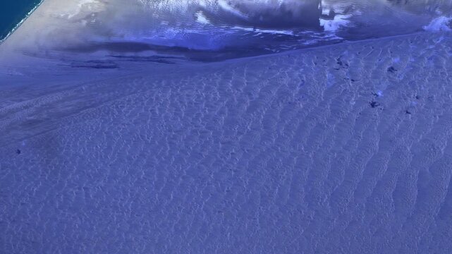 Sunrise timelapse flying over dramatic desert coastline and sand dunes satellite view from space based on Nasa imagery