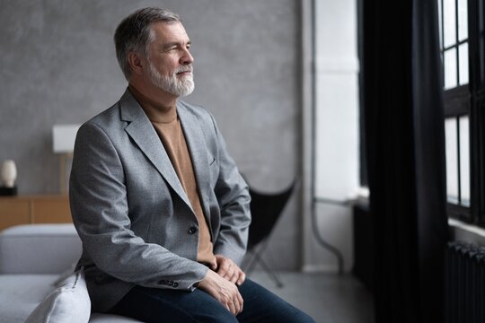 Portrait of a confident mature businessman near the window.