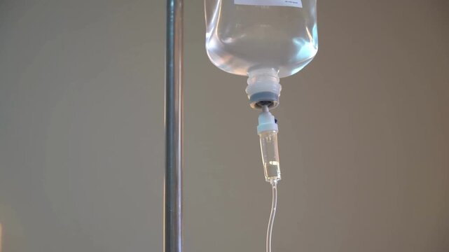 Close Up of IV Drip Bag Intravenous Fluid in Hospital Room