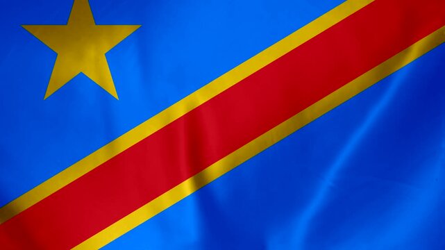 Democratic Republic of Congo flag waving in the wind with a golden star and red stripe on blue background
