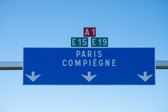 View of a French and European autoroute with overhead directional signs pointing to major cities like Paris, Bordeaux, Lille, Calais, showing lanes, traffic and motorway infrastructure, road signes