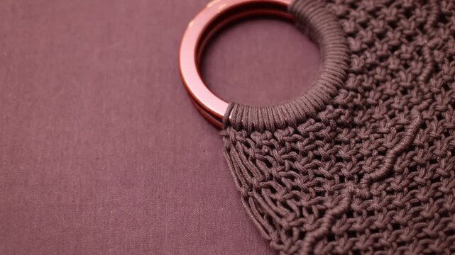 Close-up of dark brown knitted fabric texture
