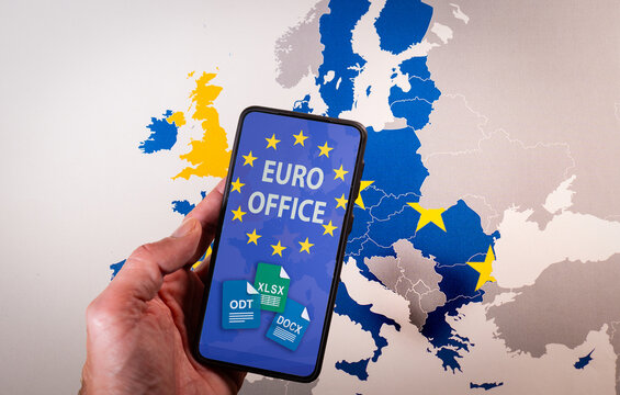 Hand holding a smartphone displaying the Euro Office app and file icons, representing open source office software and digital sovereignty in the European Union. Concept of European digital sovereignty