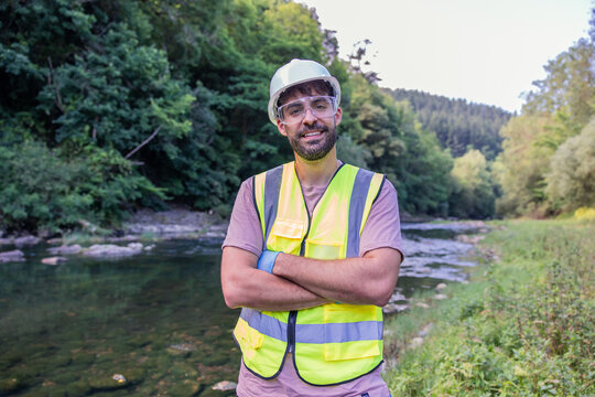 Environmental engineer checking water quality in river