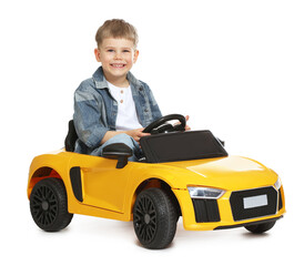 Fototapeta premium Little child driving toy car on white background