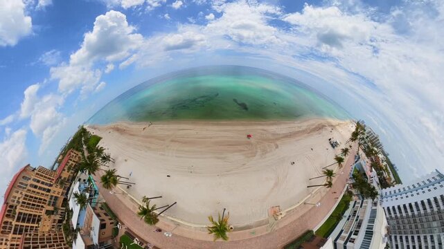 Aerial tiny planet Hollywood Beach Florida facing east at Atlantic Ocean