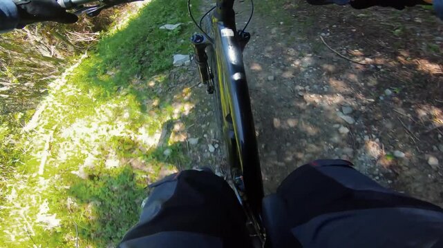 Cyclist ride bicycle at mountain trail road