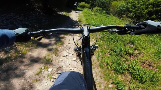 Cyclist ride bicycle at mountain trail road