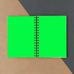 Vibrant notebook with green pages, suitable as mockup