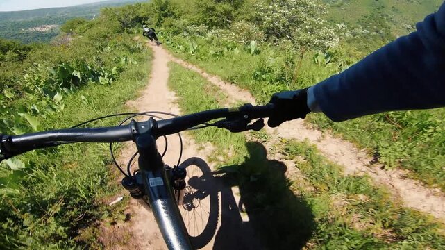 Cyclist ride bicycle at mountain trail road