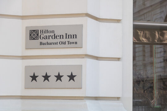 Exterior sign of Hilton Garden Inn Bucharest Old Town hotel mounted on a historic building facade in Bucharest - Bucuresti, Romania - March 15 2026