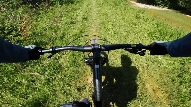 Cyclist ride bicycle at mountain trail road