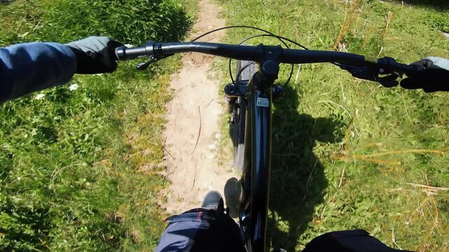 Cyclist ride bicycle at mountain trail road