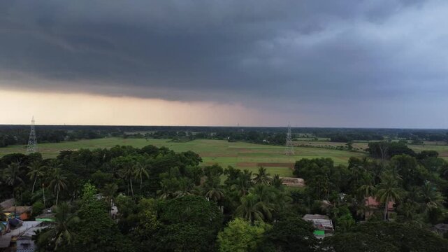 Indian Monsoon Season Overcast Sky Looming Over Rural Village Lands and Patchy Fields
