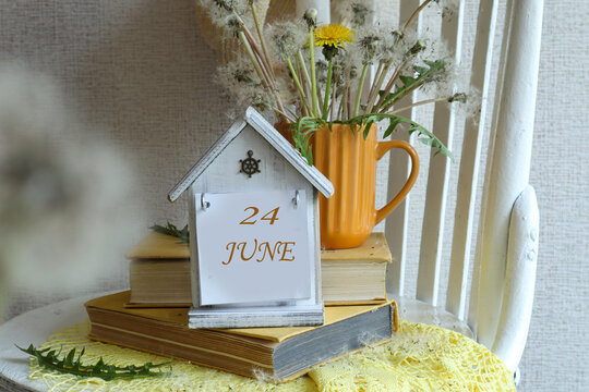 June 24th Calendar: A decorative calendar with the number 24 and the name of the month of June in English against a background of a bouquet of dandelions