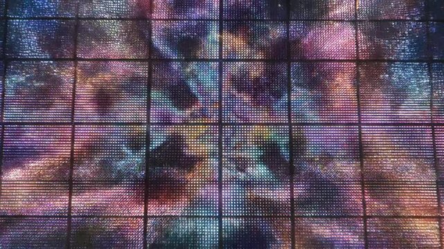Vibrant tie-dye pattern on pixelated grid background