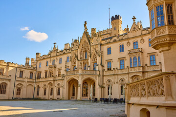 Fototapeta premium Exquisite gothic revival castle with ornate architecture and majestic facade