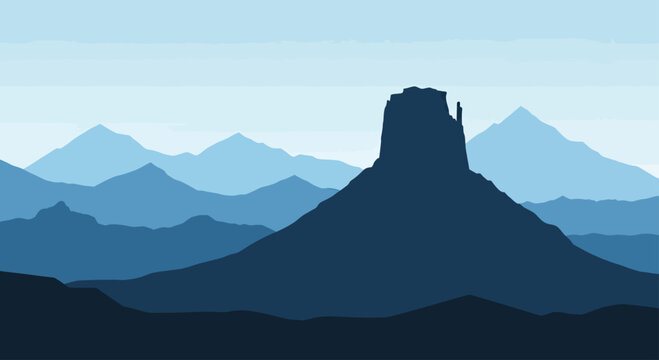 A stark, blue mountain range silhouette against a pale sky, with a prominent mesa