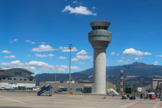 Quito, Ecuador - May 19, 2026: Modern airport air traffic control tower against mountains. Mariscal Sucre International Airport (UIO). Editorial Use.