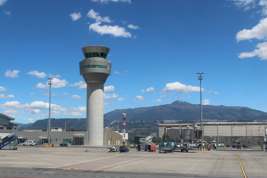 Quito, Ecuador - May 19, 2026: Modern airport air traffic control tower against a scenic mountain view. Mariscal Sucre International Airport (UIO). Editorial Use.