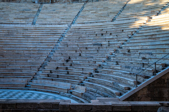 Close-up view of the circular stone seating rows and stair steps inside the Odeon of Herodes Atticus in Athens, highlighting the structure of the ancient amphitheatre.