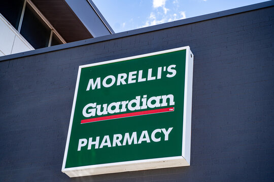 Close up of Morelli's Guardian Pharmacy sign on building. Markham, Canada - May 30, 2026.