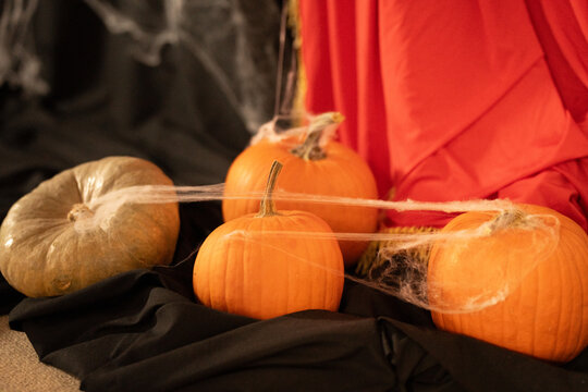 Spooky season home decor scene with pumpkins cobweb spider candle for Halloween party autumn celebration festive interior fall decoration cozy holiday background festive interior fall celebration