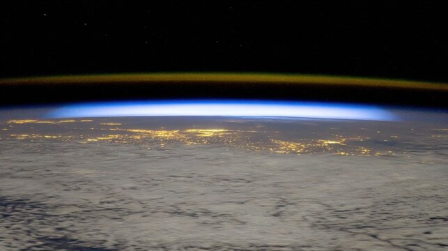 Earths Horizon and City Lights Viewed from Space.