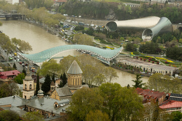 The Bridge of Peace is a stunning bow-shaped pedestrian bridge spanning the Mtkvari (Kura) River in Tbilisi, Georgia. © Afonso Farias