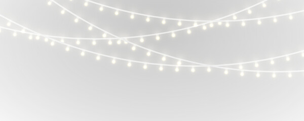 Shimmering holiday lights PNG with golden garland and soft glowing bulbs, perfect for Christmas overlays, banners, and festive card designs. © kleinstock